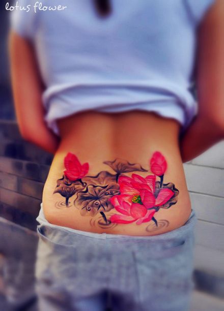 pretty watercolor paint pink black flower tattoo on lower back