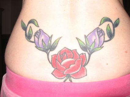 Appealing Italian rose chain lower back tattoo