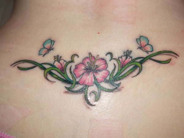 Girlish pink flower chain with butterflies lower back tattoo
